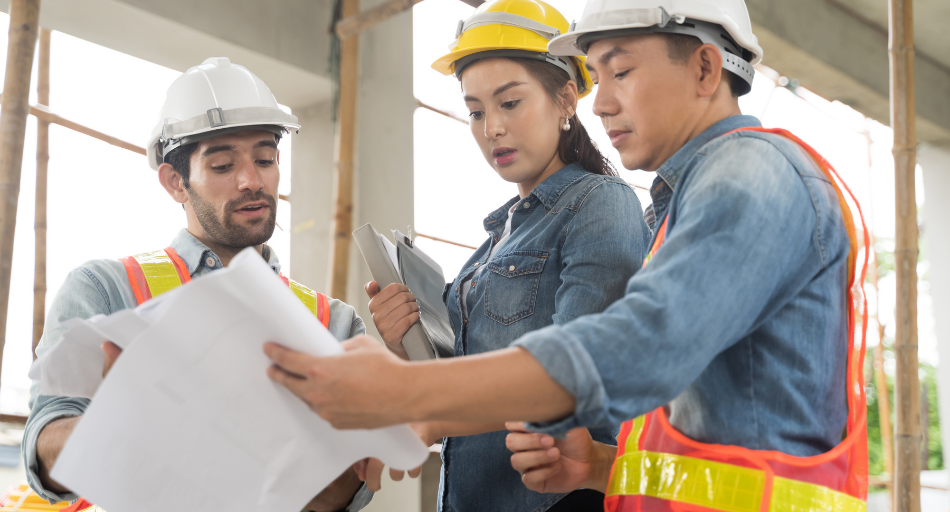 construction workers looking at plans